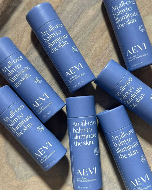 Aevi Lumi Balm – illuminating balm for a natural, effortless glow – packaged in a sustainable biodegradable paper tube